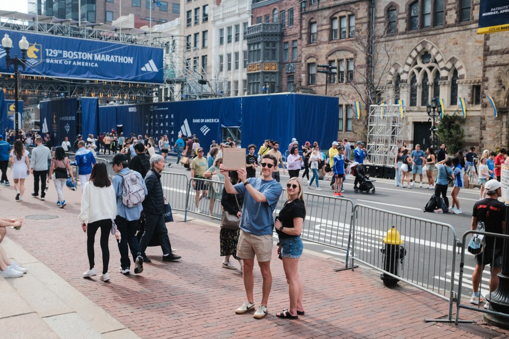 Boston Marathon finishing line, featuring Pizzeria Regina